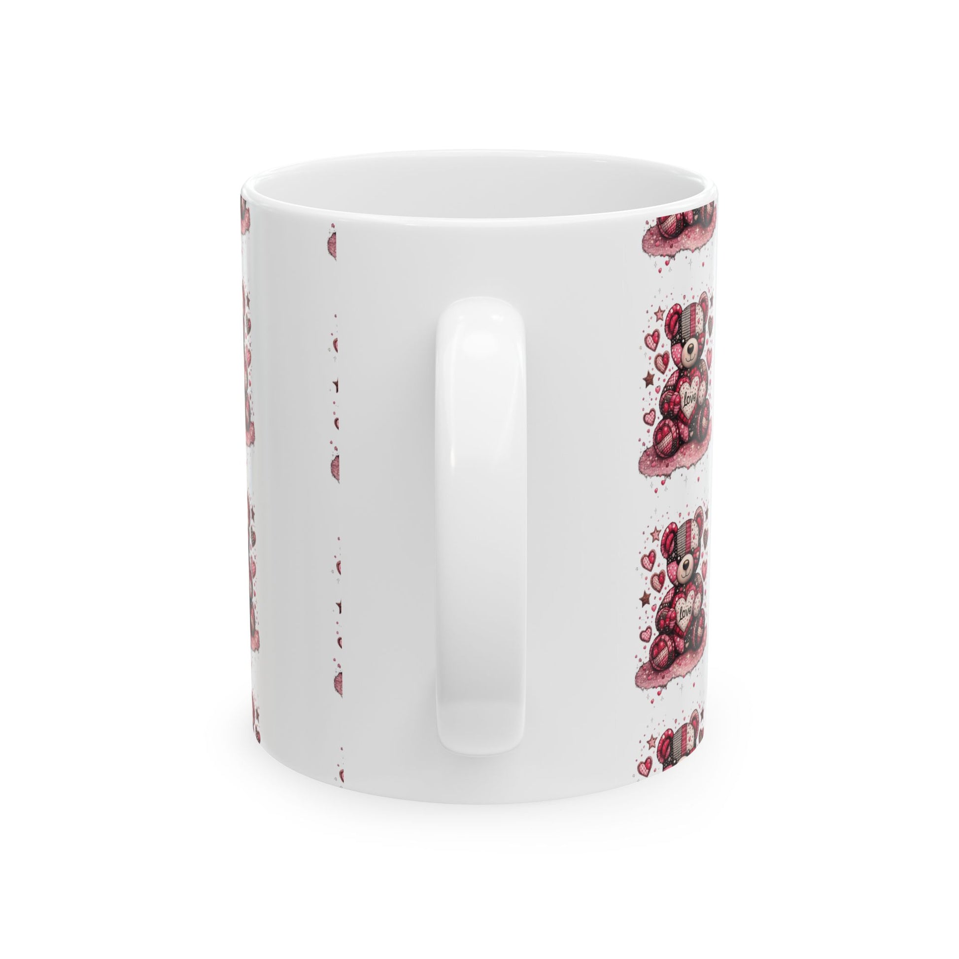 White ceramic coffee mug featuring a red and pink checkered teddy bear design with hearts on a plain background.