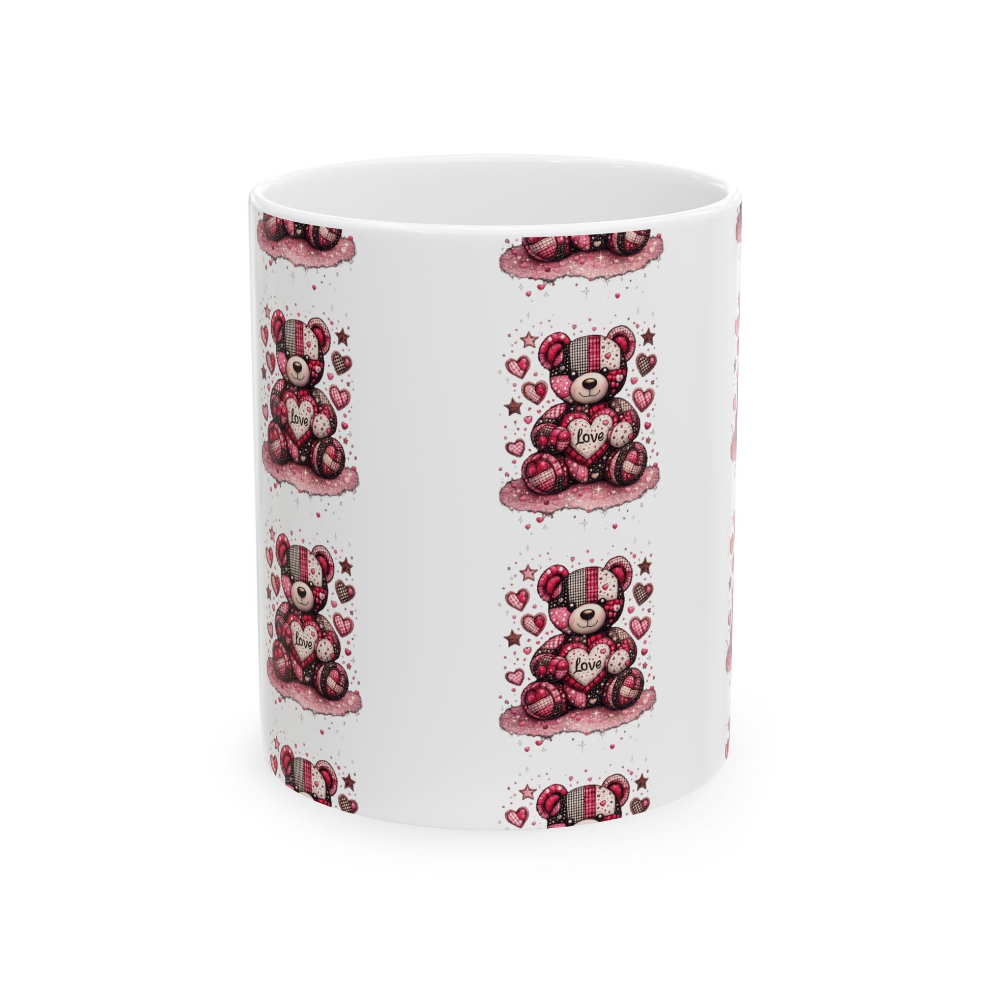 White ceramic coffee mug featuring a patchwork teddy bear holding a love heart design, repeating on a white background.