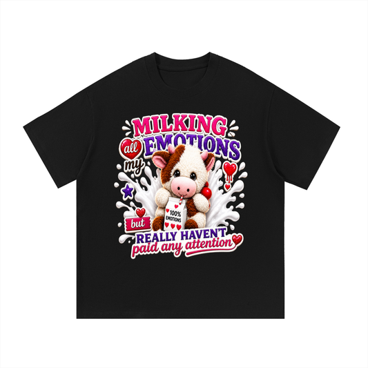 Black t-shirt with a cow plushie graphic and text on a white background
